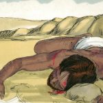 A beaten man by the side of the road